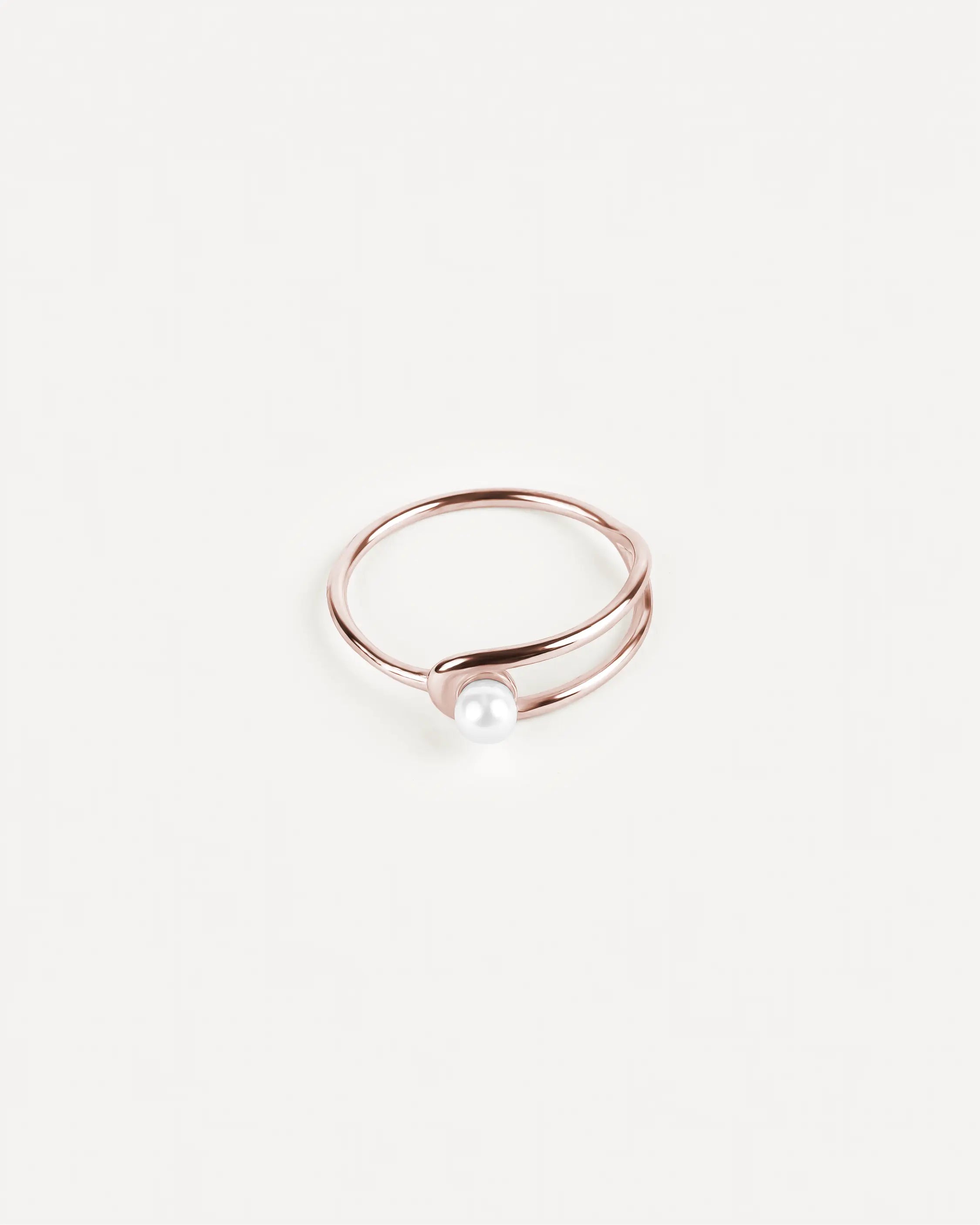 Roségoldener Éclat Sphère Ring aus 316L-Edelstahl und einer Glasperle, vollständig sichtbar.